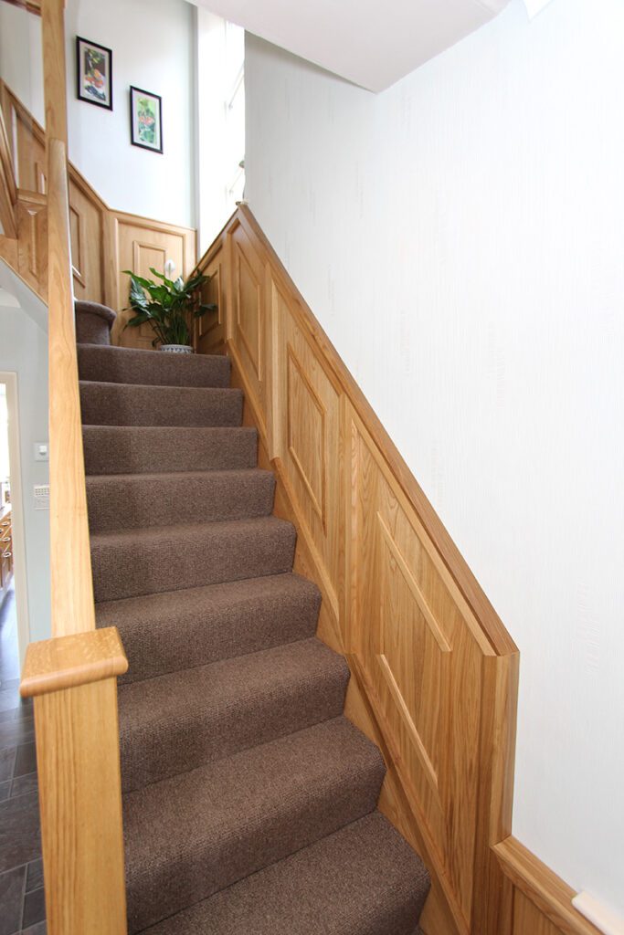 Staircase with wall panelling