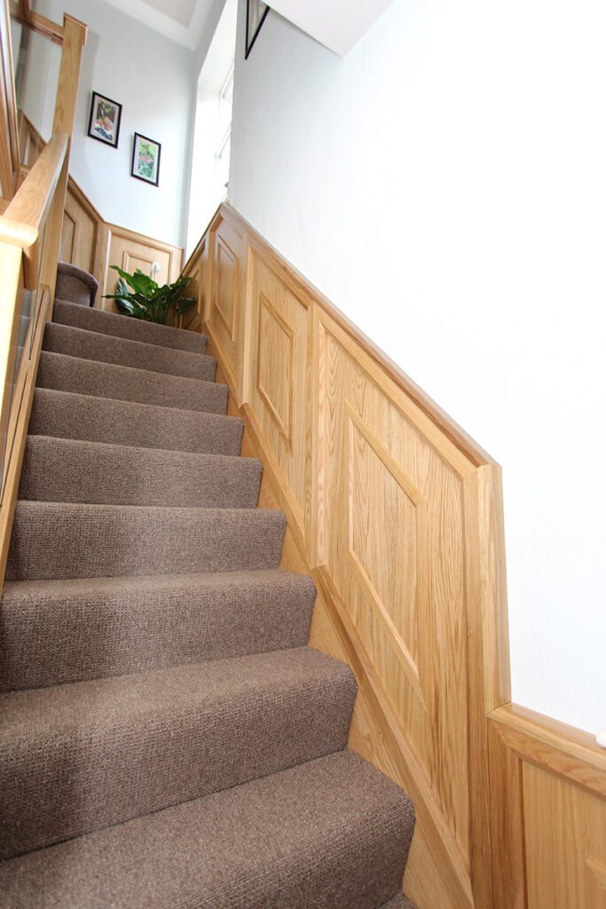 Staircase with wall panelling